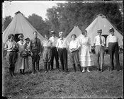 Group of people in front of tents